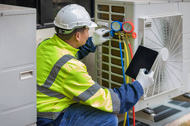 Professional Hvac technician working in Plainville, MA